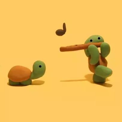 Clay Snake Playing Flute Image of a clay snake playing the flute